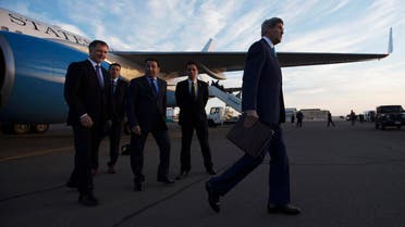 U.S. Secretary of State John Kerry, right, walks to his motorcade after being greeted by U.S. Ambassador to Egypt Stephen Beecroft, left, in Sharm el-Sheikh, Egypt Friday, March 13, 2015. (AP)