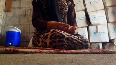  this file photo taken Wednesday, Oct. 8, 2014, a 15-year-old Yazidi girl captured by the Islamic State group and forcibly married to a militant in Syria sits on the floor of a one-room house she now shares with her family after escaping in early August. (AP)