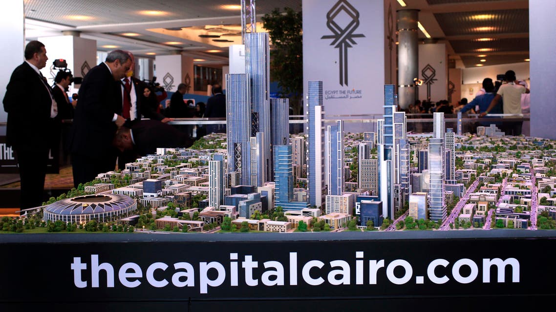 FILE - In this Saturday, March 14, 2015 file photo, a model of a planned new capital for Egypt is on display at an economic conference in Sharm el-Sheikh, Egypt. It's a monumental, ambitious project: An eco-friendly city the size of Singapore in the desert outside Cairo to serve as a new capital, with skyscrapers and a park more than twice the size of New York's Central Park. But urban planners and real estate experts say the plans remain a mystery and are skeptical it can or should be done. (AP Photo/Hassan Ammar, File)