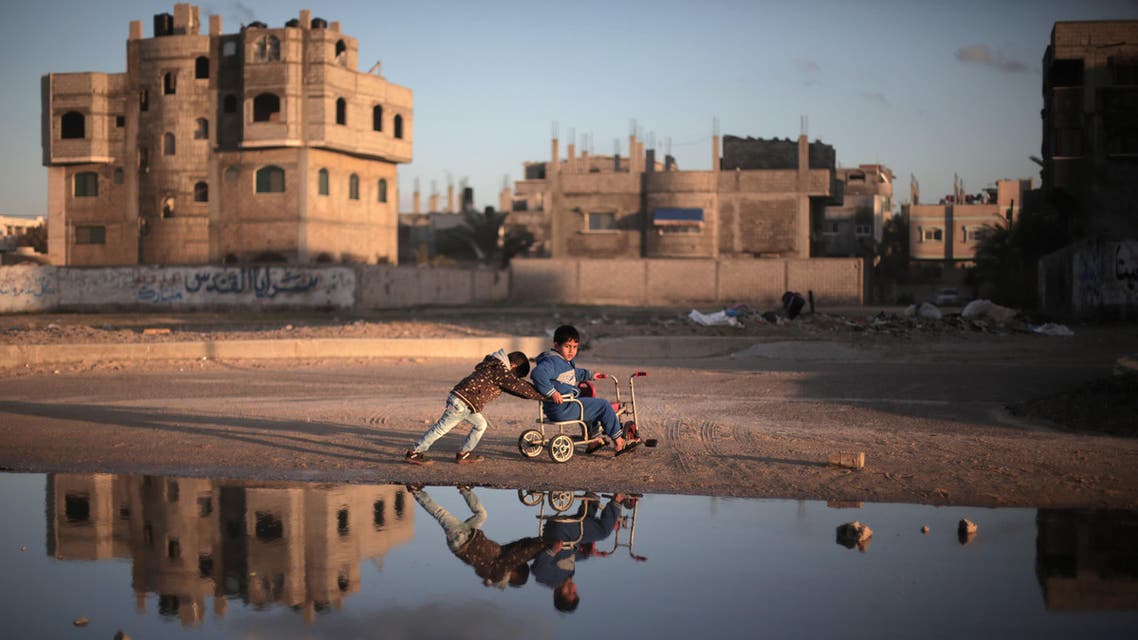 Palestinian children play on the street in Deir el-Balah refugee camp, central Gaza Strip, Saturday, Feb. 21, 2015. (AP)