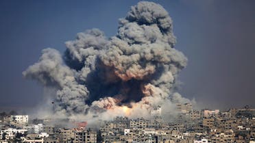 In this July 29, 2014 file photo, smoke and fire from an Israeli strike rise over Gaza City. A fierce debate is raging within Israel's military over the extent to which soldiers should be held legally accountable for their actions during last year's Gaza war, with commanders increasingly at odds with military lawyers.(AP) 