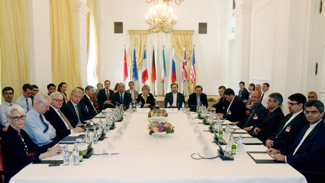 Delegates sit around a table prior to a bilateral meeting as part of the closed-door nuclear talks with Iran at a hotel in Vienna, Austria, Friday, June 12, 2015. While Swiss prosecutors are conducting an espionage investigation amid suspicions that hotels hosting the talks on Iran's nuclear program have been targeted in a cyber-spying campaign, Austria is also looking into the allegations. (AP Photo/Ronald Zak)