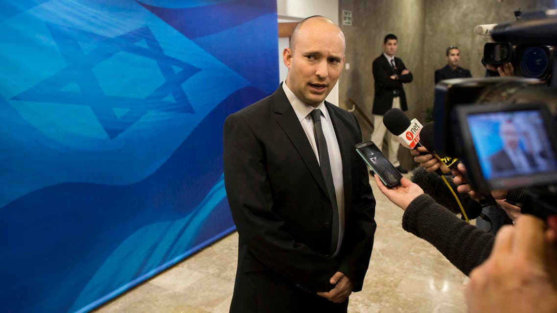 In this Sunday, Jan. 18, 2015 file photo, then Israeli Economy Minister Naftali Bennett speaks with the media ahead of a weekly cabinet meeting in Jerusalem. Bennett is slated to be minister of education in the emerging government, a post where he can infuse some of his world view in the Israeli school system. (AP Photo/Abir Sultan, Pool, File)