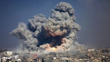 In this July 29, 2014 file photo, smoke and fire from an Israeli strike rise over Gaza City. AP