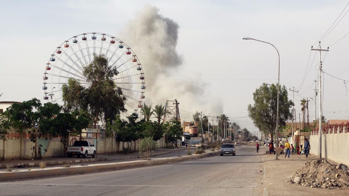 In this Saturday, May 9, 2015 photo, smoke rises after an airstrike by the U.S.-led coalition on Islamic State group positions in an eastern neighborhood of Ramadi, the capital of Anbar province, 115 kilometers west of Baghdad, Iraq. (AP)