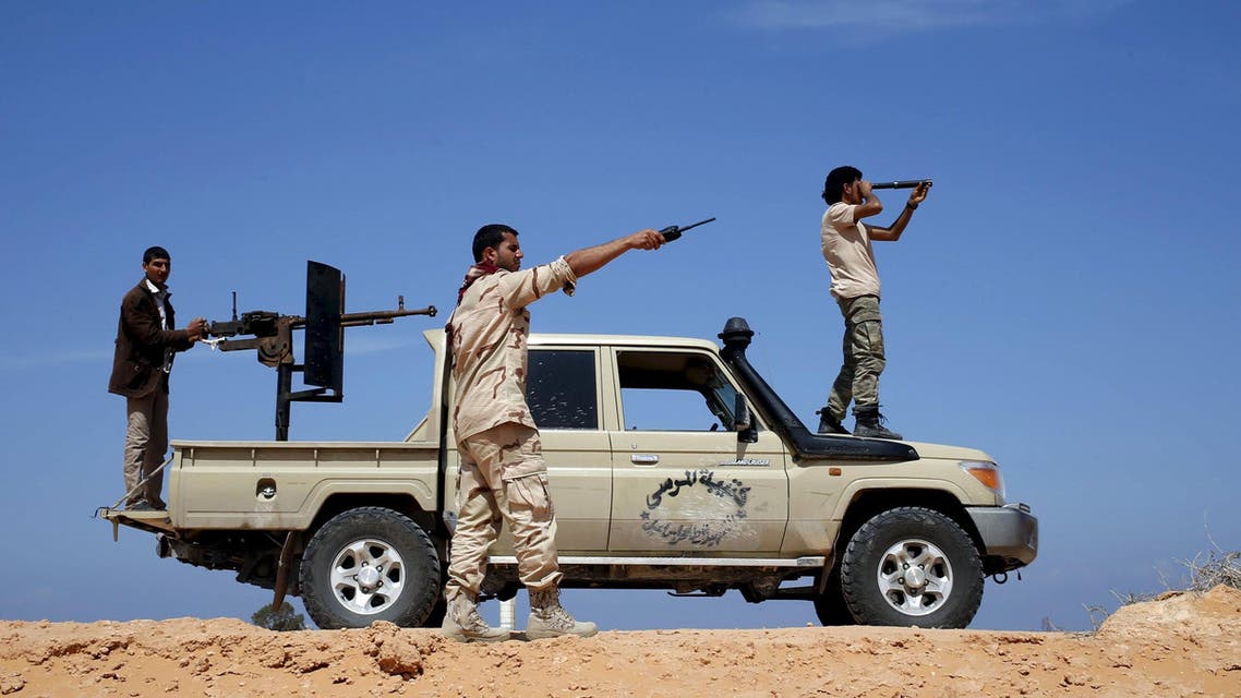Libya Dawn fighters look at Islamic State (IS) militant positions near Sirte March 19, 2015. REUTERS