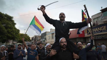 Israelis of the Druze minority take part in a demonstration of some 2000 people in the northern Israeli Druze town of Daliyat al-Carmel on June 14, 2015. (AFP)