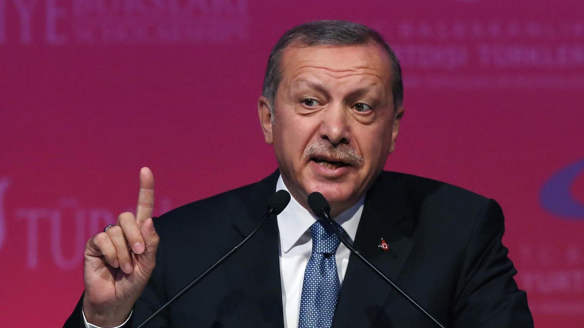 Turkey's President Recep Tayyip Erdogan speaks during a graduation ceremony for foreign students in Ankara, Turkey, Thursday, June 11, 2015. In his first televised appearance since his ruling party lost its parliamentary majority, Erdogan has asked all Turkish political parties to put aside their differences and rapidly form a new government. Erdogan had campaigned voraciously in a bid to win a supermajority for the ruling party, which would have enabled it to change the constitution and usher in a presidential system allowing him to control government affairs. The party is now forced to seek a coalition partnership.(AP Photo/Burhan Ozbilici)