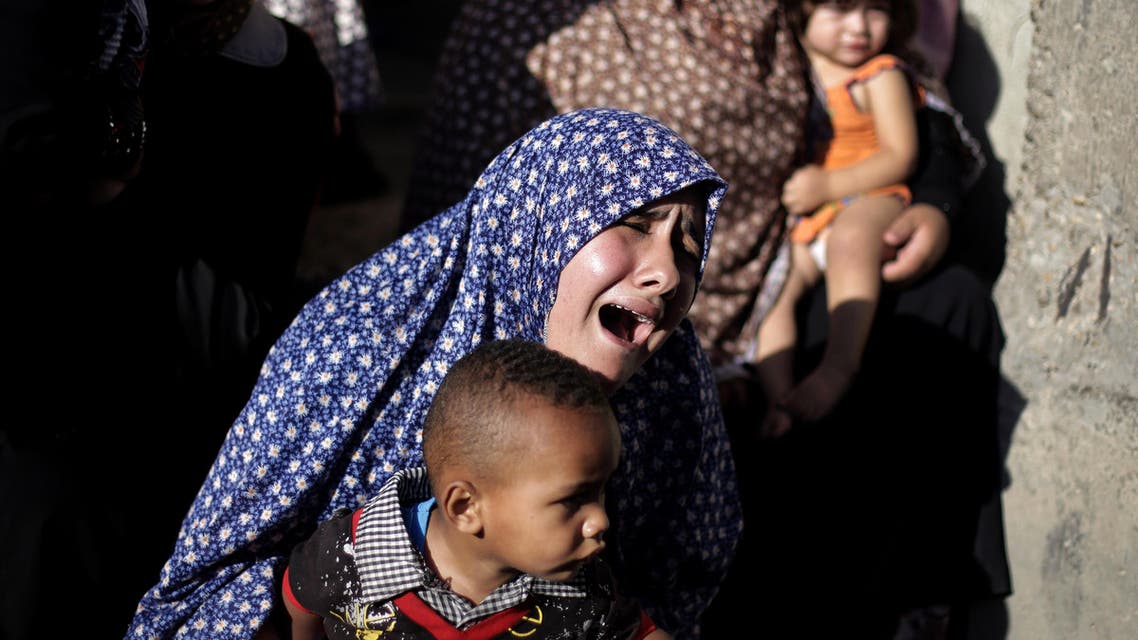 A Palestinian relative of four boys from the same extended Bakr family, grieves in the family house during their funeral in Gaza City, Wednesday, July 16, 2014. (AP)