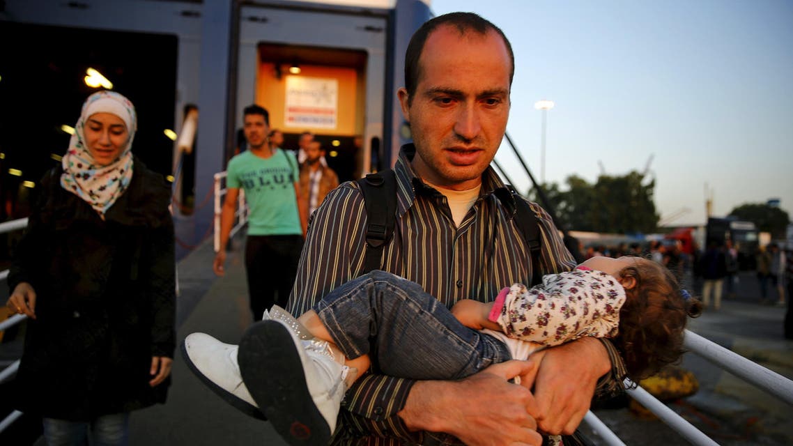 Syrian refugees disembark from a Greek ferry after arriving in the port of Piraeus near Athens June 14, 2015. (AP)