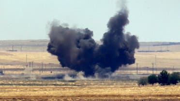 The Turkish side of the border between Turkey and Syria, in Akcakale, Sanliurfa province, southeastern Turkey, smoke from a US-led airstrike rises over the outskirts of Tal Abyad, Syria, Sunday, June 14, 2015. (File Photo: AP)