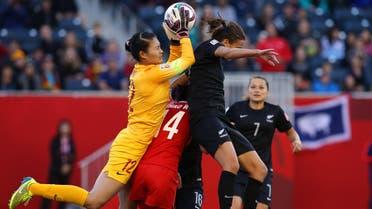Jun 15, 2015; Winnipeg, Manitoba, CAN; China PR goalkeeper Wang Fei (12) makes a save against New Zealand forward Amber Hearn (right) over China PR forward Zhao Rong (14) in the second half of a Group A soccer match in the 2015 FIFA women's World Cup at Winnipeg Stadium. The game ended in a 2-2 tie. Mandatory Credit: Bruce Fedyck-USA TODAY Sports Open in New Window Download