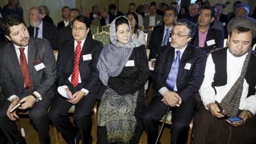 (Front row L-R) Afghan Deputy Foreign Minister Hekmat Khalil Karzai, Transportation and Commerce Minister Anwar ul-Haq Ahady, Women's Affairs Minister Husn Banu Ghazanfar, former vice president Yunus Qanuni, and member of parliament Mohammad Mohaqiq attend the opening of the Oslo Forum 2015 in Losby Manor, north of Oslo, June 16, 2015. Reuters