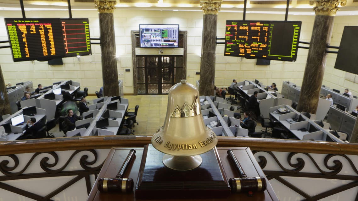 In this Nov. 27, 2014 file photo, Egyptian traders work on the floor of the stock market, in Cairo, Egypt. (AP)