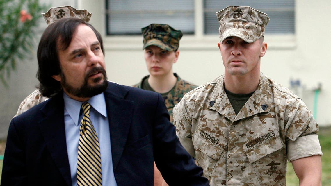 Marine Corps Sgt. Lawrence Hutchins, right, is escorted into his preliminary hearing by his civilian defense counsel J. Richardson Brannon. (File: AP)