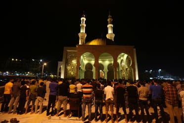 Palestinian people take part in a prayer called Tarawih, on the eve of the holy fasting month of Ramadan in Gaza City, on June 17, 2015. AP 