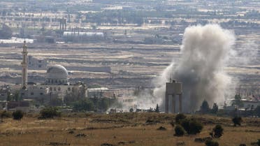 Smoke rises during fighting in the village of Ahmadiyah in Syria, as seen from the Israeli side of the border fence between Syria and the Israeli-occupied Golan Heights, June 17, 2015. (Reuters)