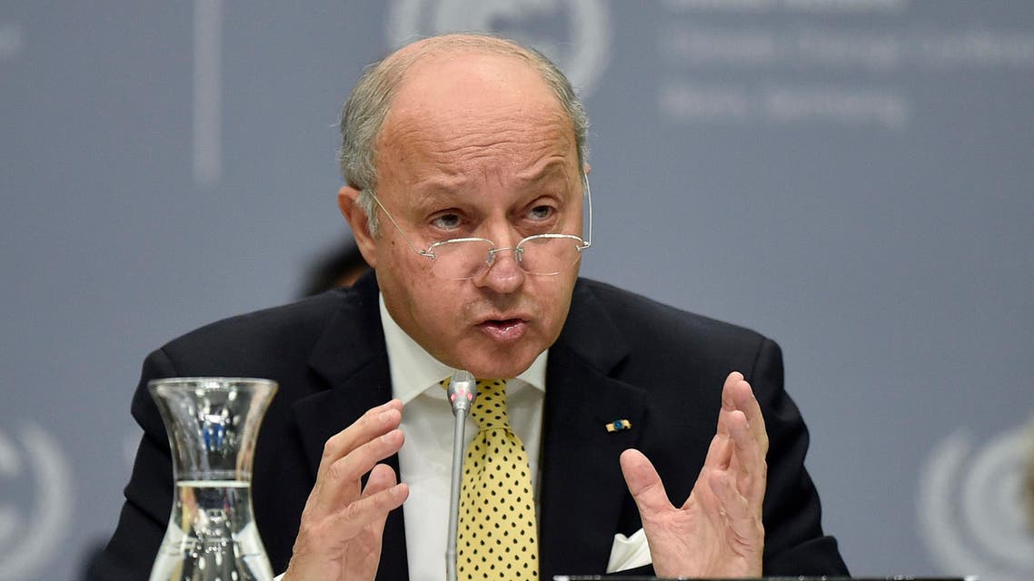 French foreign minister Laurent Fabius talks to delegates during the United Nations Framework Convention on Climate Change in Bonn, Germany, Monday, June 1, 2015. (AP Photo/Martin Meissner)