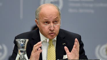 French foreign minister Laurent Fabius talks to delegates during the United Nations Framework Convention on Climate Change in Bonn, Germany, Monday, June 1, 2015. (AP Photo/Martin Meissner)