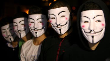 Lebanese activists wear masks as they protest against corrupt governments and corporations, in support of the anonymous activist moment, at the Martyrs square, in downtown Beirut, Lebanon, Tuesday, Nov 5, 2013. (AP)