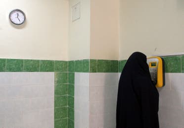 An Iranian female prisoner makes a call in a corridor in the Evin prison in Tehran, Iran. (File: AP)