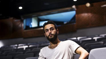 Bashar Murkus, author and director of 'A Parallel Time", sits in Almidan theater during an interview, in the Israeli northern city of Haifa June 17, 2015. Israel froze state funding on Tuesday for an Arab theatre whose play about jailed Palestinians angered the right, fuelling accusations that the government aims to suppress productions it deems pro-Palestinian. Culture Minister Miri Regev, who has threatened to divert money from institutions seeking to "hurt the state", said that irregularities discovered in al-Midan theater's finances led to her decision to withhold government money. REUTERS/Nir Elias