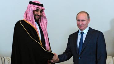 Russian President Vladimir Putin shakes hands with Saudi Arabia's Defense Minister Prince Mohammed Bin Salman in the Konstantin Palace outside St. Petersburg, Russia, Thursday, June 18, 2015. (Mikhail Klimentyev/RIA-Novosti, Kremlin Pool Photo via AP)