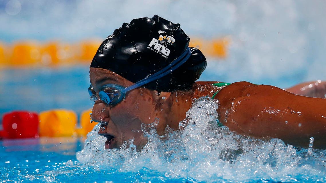 Egypt's Farida Osman competes in a heat of the Women's 100m butterfly at the FINA Swimming World Championships in Barcelona, Spain, Sunday, July 28, 2013.