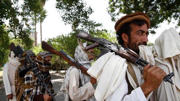 Taliban fighters hold their heavy and light weapons before surrendering them to Afghan authorities in Kabul on July 31, 2011. (File Photo: AP)