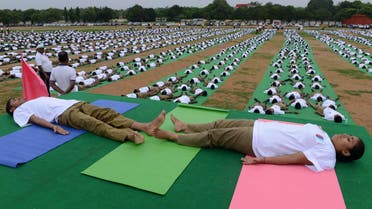  National Cadet Corps (NCC) participate in a mass yoga session to mark International Yoga Day at the parade grounds in Secunderabad, the twin city of Hyderabad on June 21, 2015. AFP
