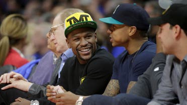 Floyd Mayweather Jr. sits courtside during the first half of Game 6 in a second-round NBA basketball playoff series between the Los Angeles Clippers and the Houston Rockets in Los Angeles, Thursday, May 14, 2015. (AP)