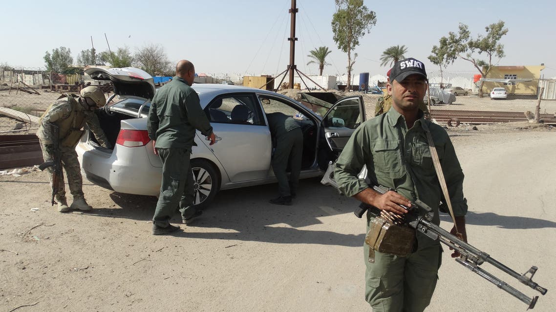 Iraqi security forces search a vehicle during a security operation to arrest Islamic State extremists and confiscate weapons at a refugee camp in Habaniyah, 80 kilometers (50 miles) west of Baghdad, Iraq, Thursday, June 18, 2015. (AP Photo)