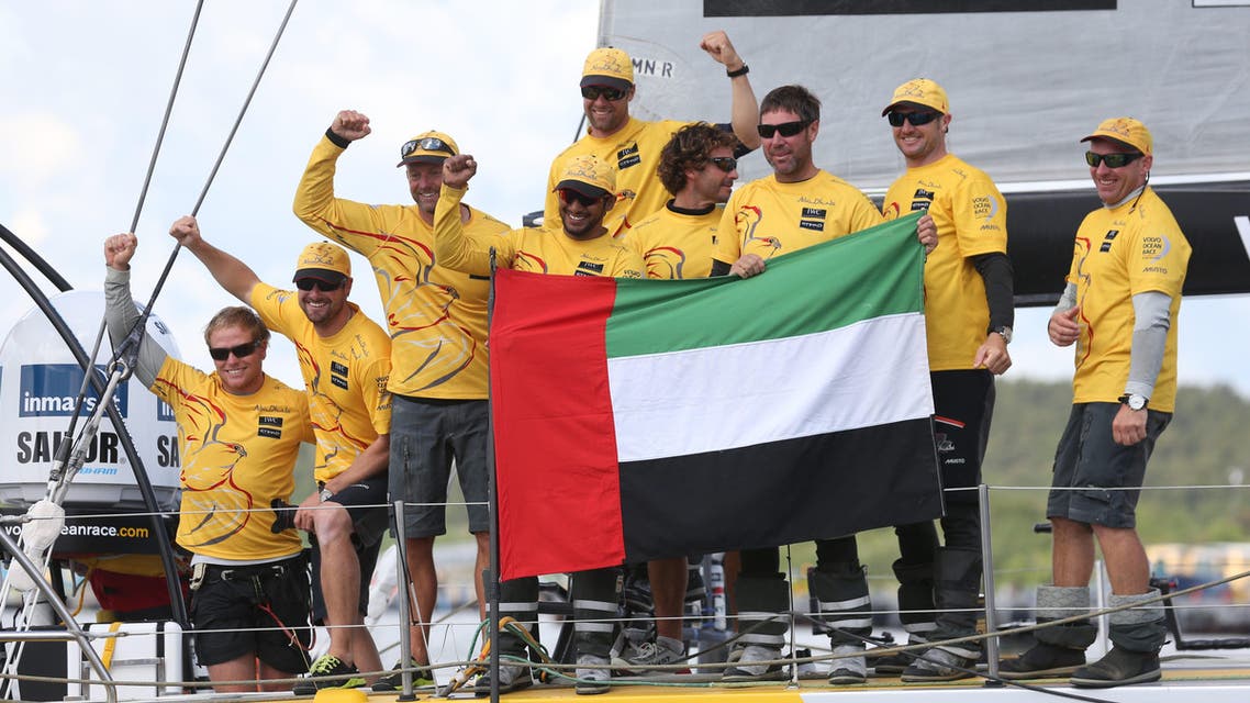 Overall winner Abu Dhabi Ocean Racing team skippered by Britain's Ian Walker, 3rd left, celebrate after crossing the finish line of the 9th leg of the Volvo Ocean Race from French Lorient to Gothenburg, in Gothenburg, Sweden, on Monday June 22, 2015. AP