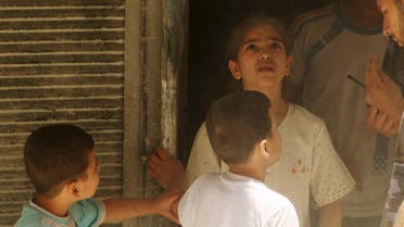 A girl reacts at a site hit by what activists said was a barrel bomb dropped by forces loyal to Syria's President Bashar al-Assad in al-Kalaseh neighbourhood of Aleppo, Syria. (File: Reuters)