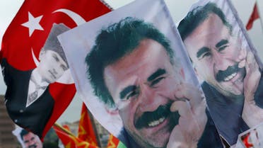 Flags with a picture of the jailed Kurdish militant leader Abdullah Ocalan and of modern Turkey's founder Mustafa Kemal Ataturk (L) are pictured during a gathering of supporters of the Pro-Kurdish Peoples' Democratic Party (HDP) to celebrate the party's victory during the parliamentary election, in Istanbul, Turkey, June 8, 2015. Turkey faced the prospect of weeks of political turmoil after the ruling AK Party lost its parliamentary majority in weekend polls, dealing a blow to President Tayyip Erdogan's ambitions to acquire sweeping new powers. REUTERS/Murad Sezer