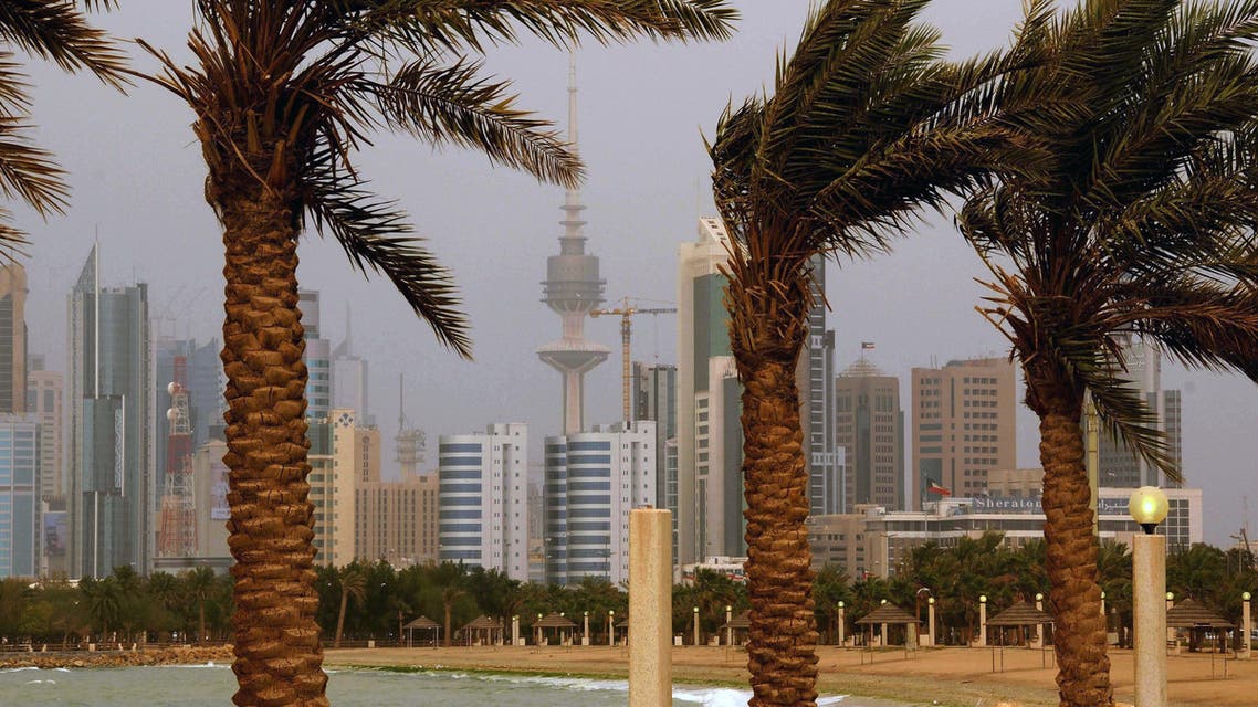 In this April 16, 2009 file photo, the Kuwait city skyline is seen through the haze of a sand storm in Shuwaikh, Kuwait City. Nabil al-Fadhl , a member of Kuwait's parliament says he is facing charges of insulting the nation after saying he supports legalizing the sale of alcohol in the predominantly Muslim country. Al-Fadhl told The Associated Press late Sunday, Jan. 4, 2015 that controversy was sparked after he first proposed repealing a law that bans dancing at public music concerts and festivals. Al-Fadhl said an Islamist lawyer filed charges against him for his remarks, accusing him of insulting the honor of Kuwaiti society. (AP Photo/Gustavo Ferrari, File)