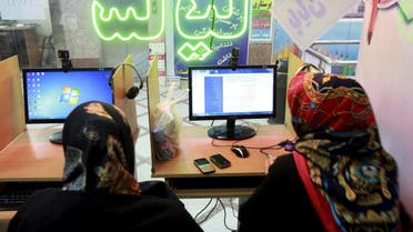 Two Iranian women surf the Internet at a cafe in Tehran, Iran, Tuesday, Sept, 17, 2013. AP