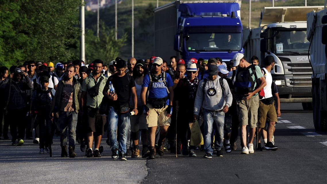 Immigrants from Syria walk on a motorway at Tabanovce near the Serbian border with Macedonia June 19, 2015. (Reuters)
