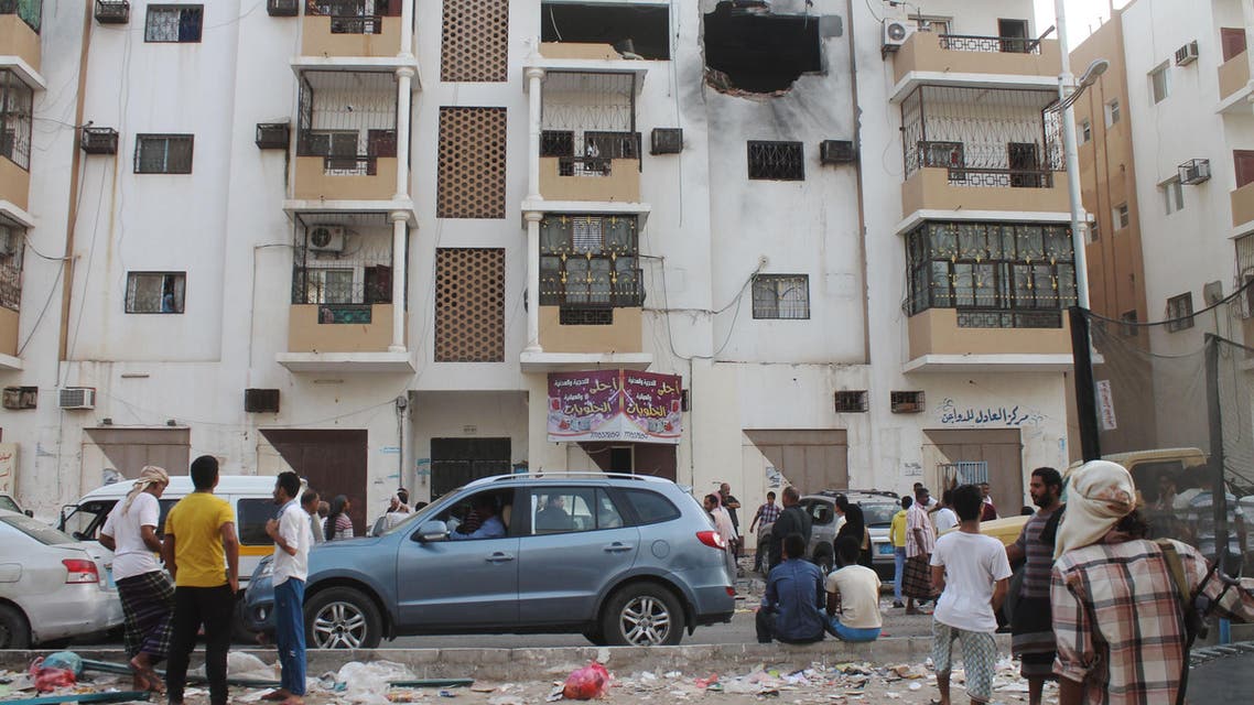 Yemenis inspect a destroyed building in Aden's suburbs on June 24, 2015 after rebel forces and loyalist fighters were locked in fierce fighting. (AFP)