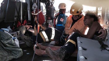 Nelly Murillo (R) as she and her baby are transported on a helicopter to a hospital in Quibdo, Choco department, Colombia, after the light aircraft in which they were travelling crashed Saturday in the forest. (AFP)