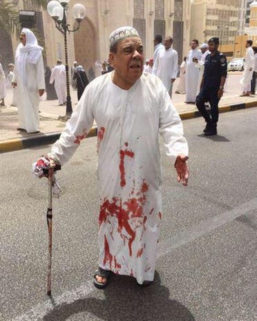 This image provided by Kuwaitna news shows a man in a blood-soaked dishdasha following of a deadly blast at a Shiite mosque in Kuwait City, Friday, June 26, 2015.  (AP)