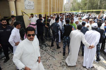 Security forces, officials and civilians gather after a deadly blast claimed by ISIS that struck worshippers attending Friday prayers at a Shiite mosque in Kuwait City, Friday, June 26, 2015. (AP)