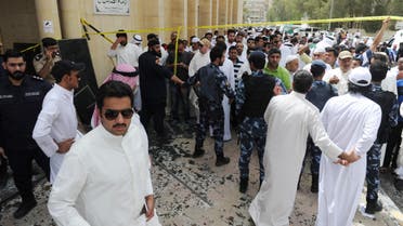 Security forces, officials and civilians gather after a deadly blast claimed by ISIS that struck worshippers attending Friday prayers at a Shiite mosque in Kuwait City, Friday, June 26, 2015. (AP)