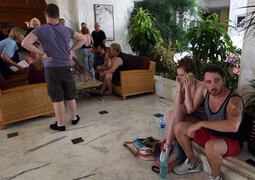  Tourists react at the Imperial hotel in the resort town of Sousse following a shooting attack. (AFP) 