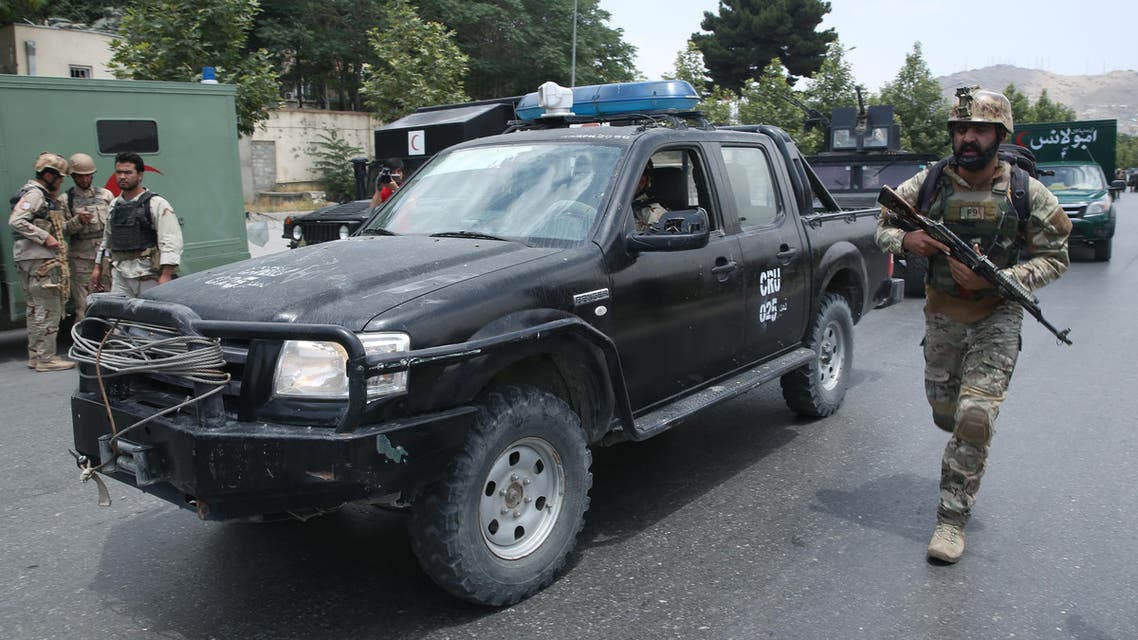 Afghan security forces take positions at the site of a suicide attack during clashes with Taliban fighters in front of the Parliament, in Kabul, Afghanistan, Monday, June 22, 2015. (AP)