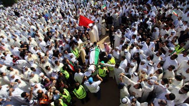 Mourners carry the body of one of the victims of the Al-Imam Al-Sadeq mosque bombing, during a mass funeral at Jaafari cemetery in Kuwait City on June 27, 2015. afp