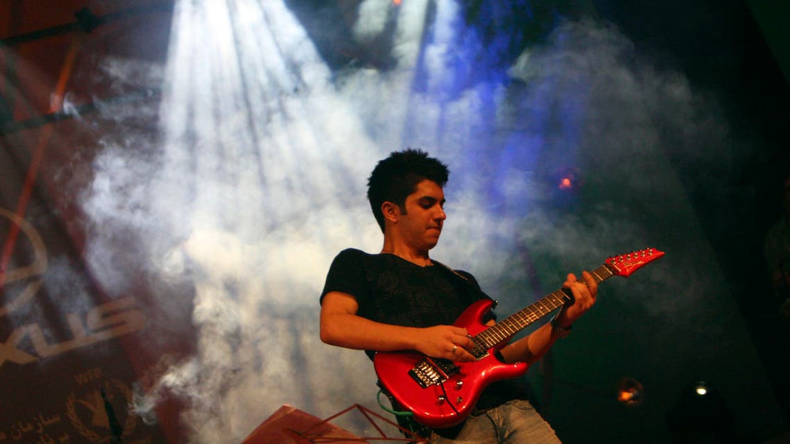 An Iranian player performs during a pop concert in Kish Island, Iran, Sunday Aug. 3, 2008. AP