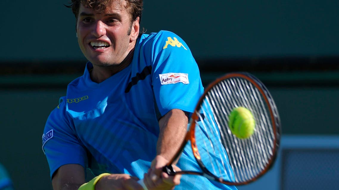 Malek Jaziri, of Tunisia, returns to Tatsuma Ito of Japan during their match at the BNP Paribas Open tennis tournament, Friday, March 13, 2015, in Indian Wells, Calif. (AP Photo/Mark J. Terrill)