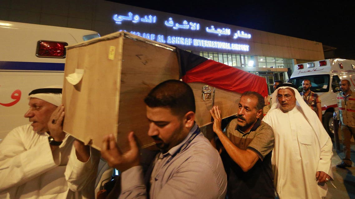 In this Saturday, June 27, 2015 photo, a coffin draped with a Kuwaiti flag belonging to a victim of a suicide bombing that targeted a Shiite mosque in Kuwait on Friday. (AP)