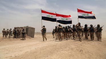 U.S. soldiers, left, participate in a training mission with Iraqi army soldiers outside Baghdad, Iraq, Wednesday, May 27, 2015. (File Photo: AP)